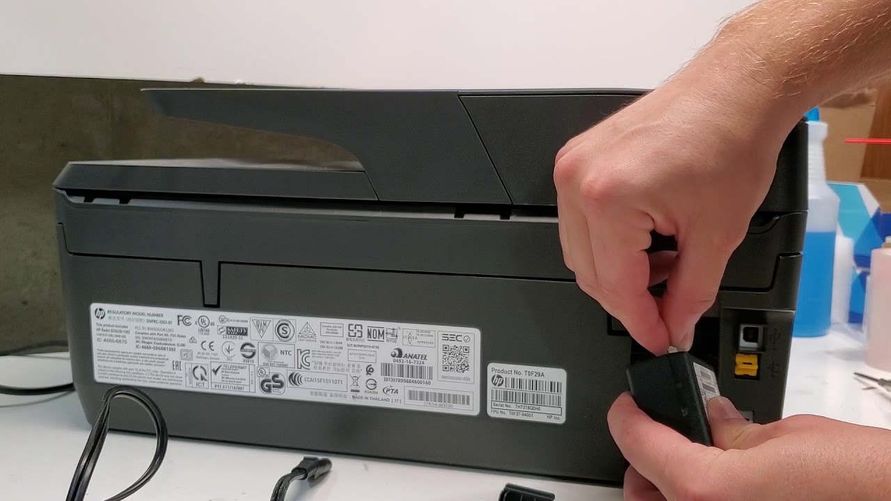 Remove the power cord from the back of the printer