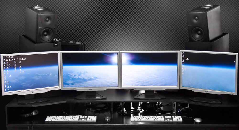 Triple monitor setup with three monitors connected to a computer